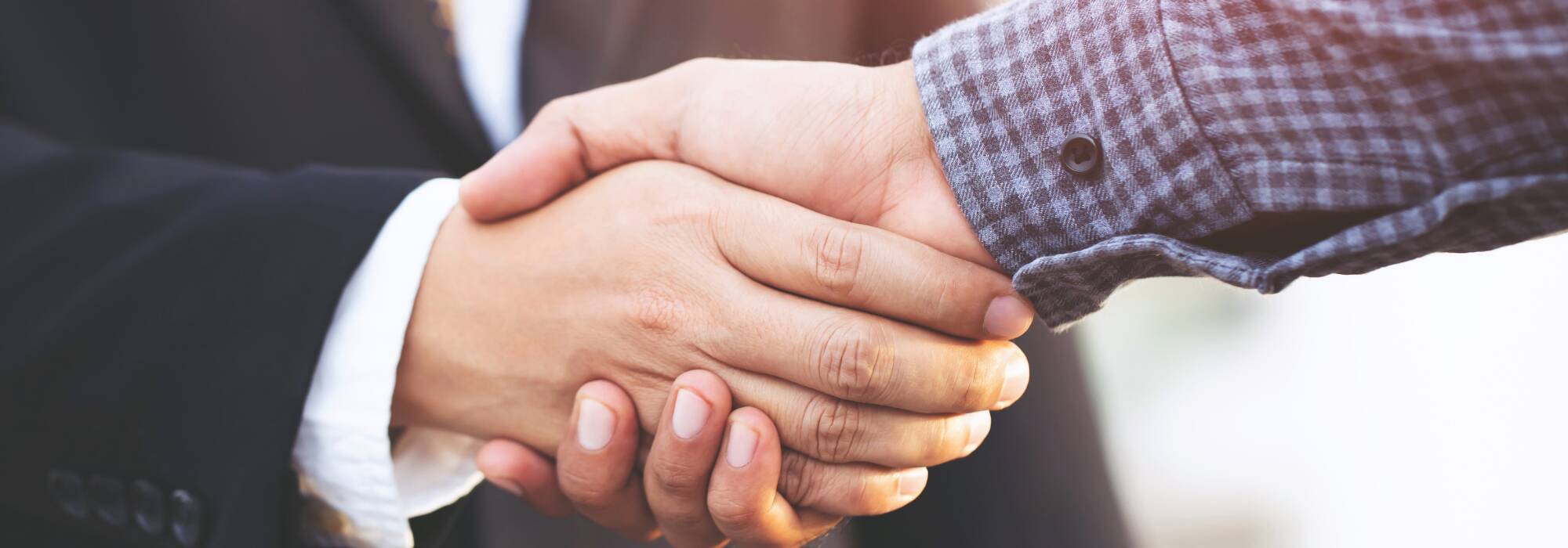 Close-up of men shaking hands